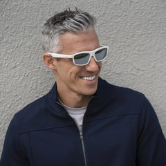Smiling man wearing Lucyd Lyte Bluetooth Sunglasses with open ear audio control
