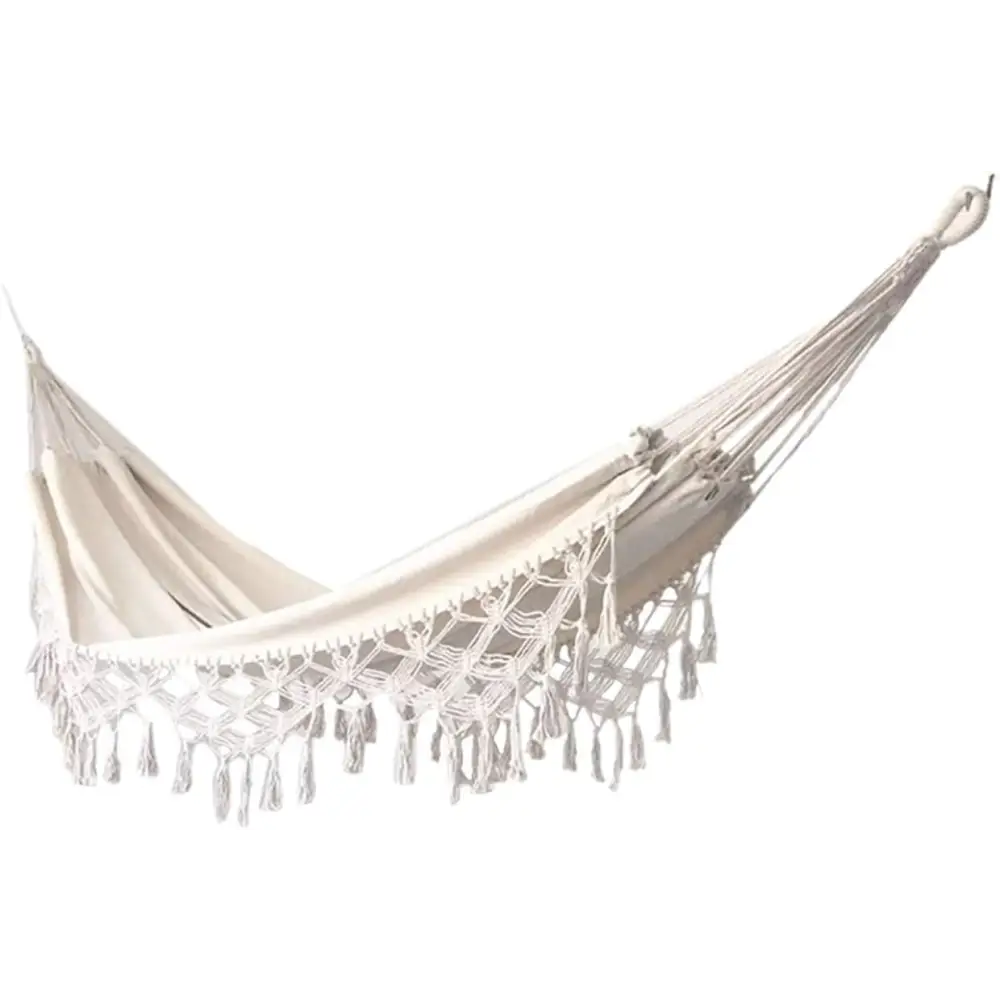 White fringed hammock featured in Boho Macrame Hammock for outdoor relaxation