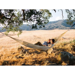 Couple enjoying comfort in a Family Size Handwoven Hammock for ultimate relaxation