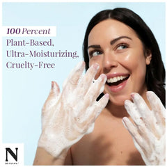 Smiling woman with soapy hands using Dr. Natural Castile Liquid Soap for cleansing