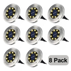 Rirool Solar Ground Lights 8 Pack for Outdoor Lighting illuminating a garden pathway