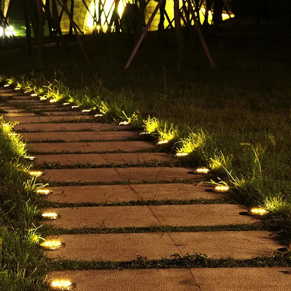 Illuminated stone pathway with Rirool Solar Ground Lights 8 Pack for outdoor lighting