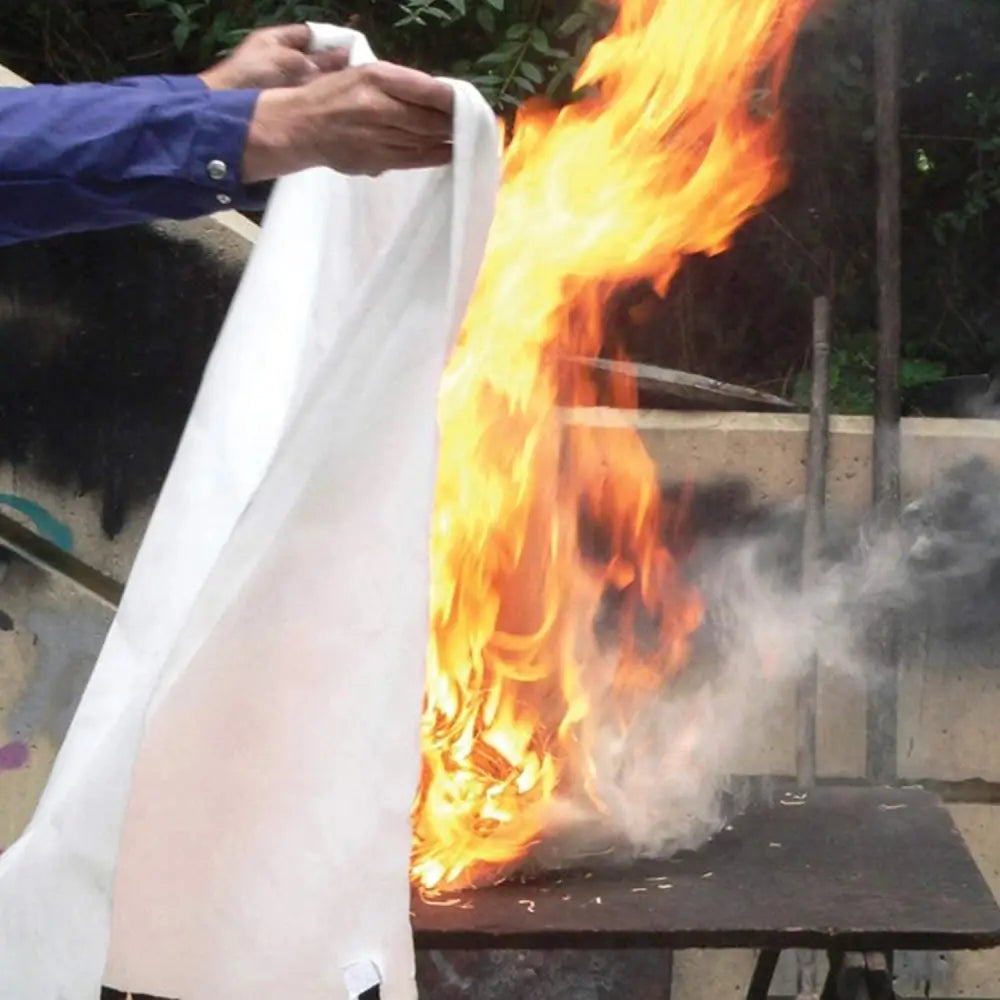 Raging fire being extinguished with TONYKO Advanced Fiberglass Fire Blanket Heat Shield